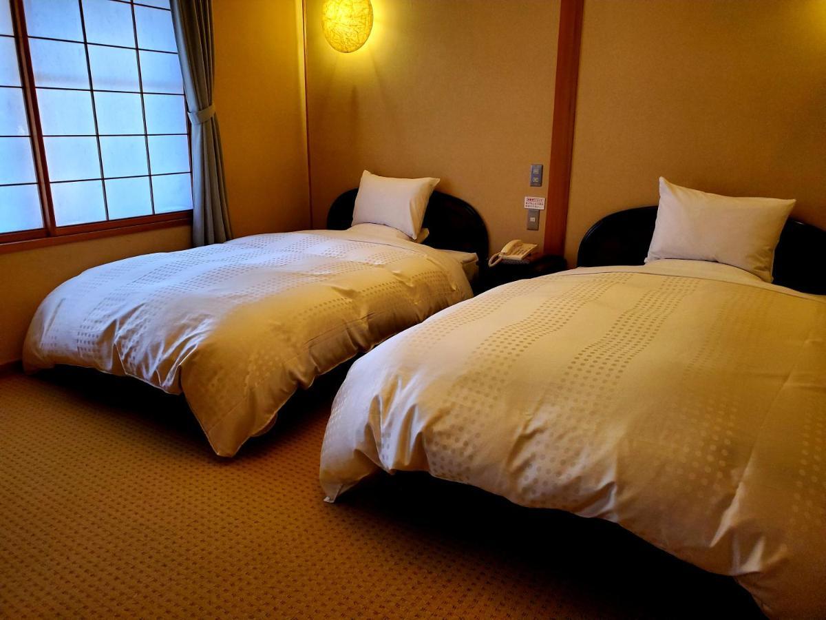 Ryotei Tanokura Hotel Yufu Exterior foto