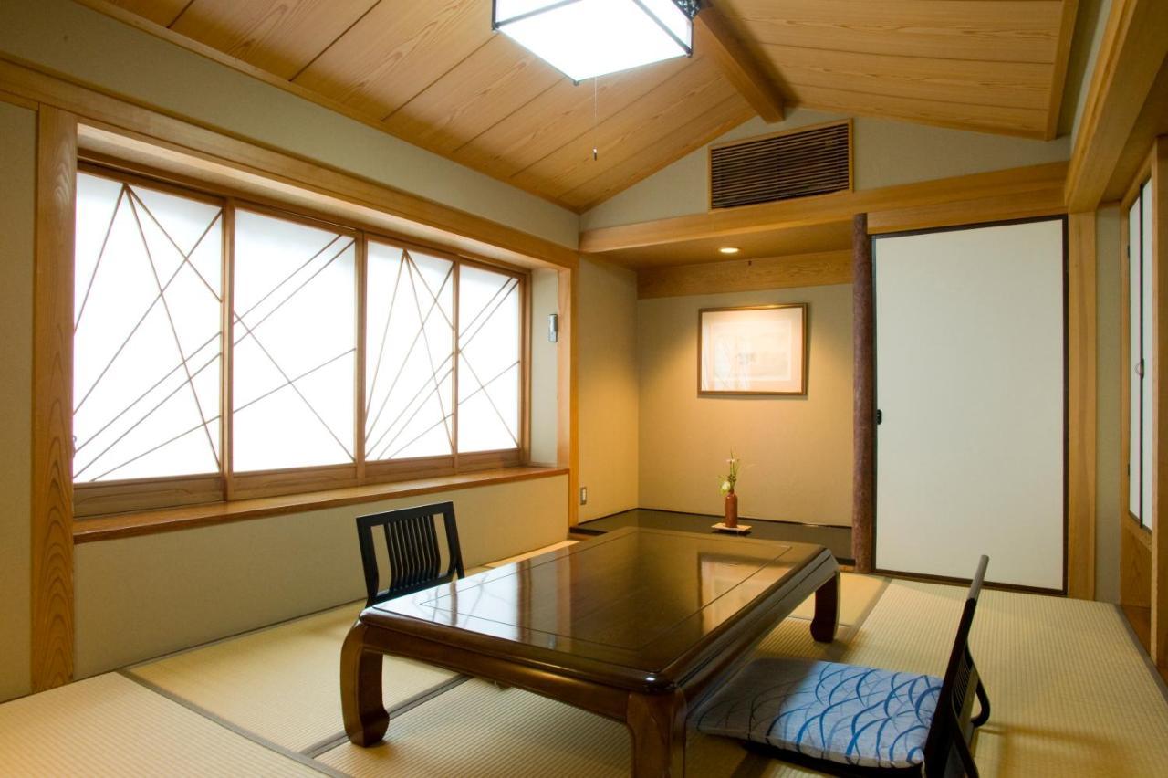 Ryotei Tanokura Hotel Yufu Exterior foto