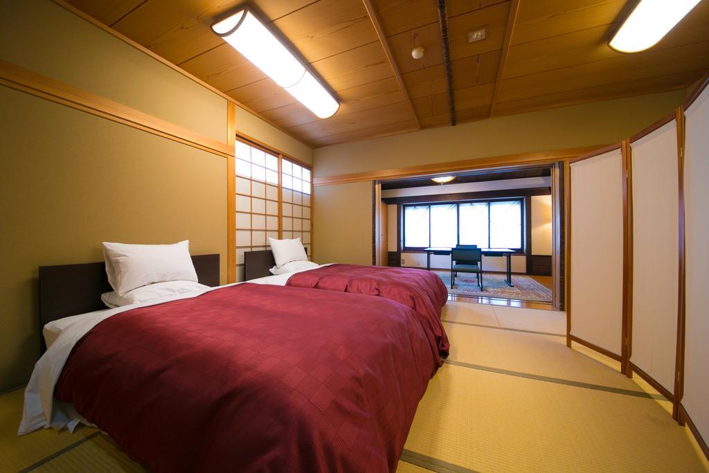 Ryotei Tanokura Hotel Yufu Exterior foto