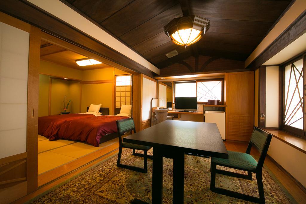 Ryotei Tanokura Hotel Yufu Exterior foto