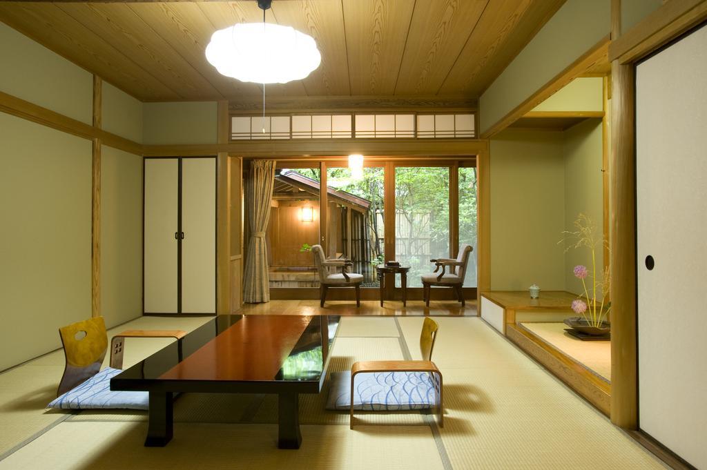 Ryotei Tanokura Hotel Yufu Exterior foto
